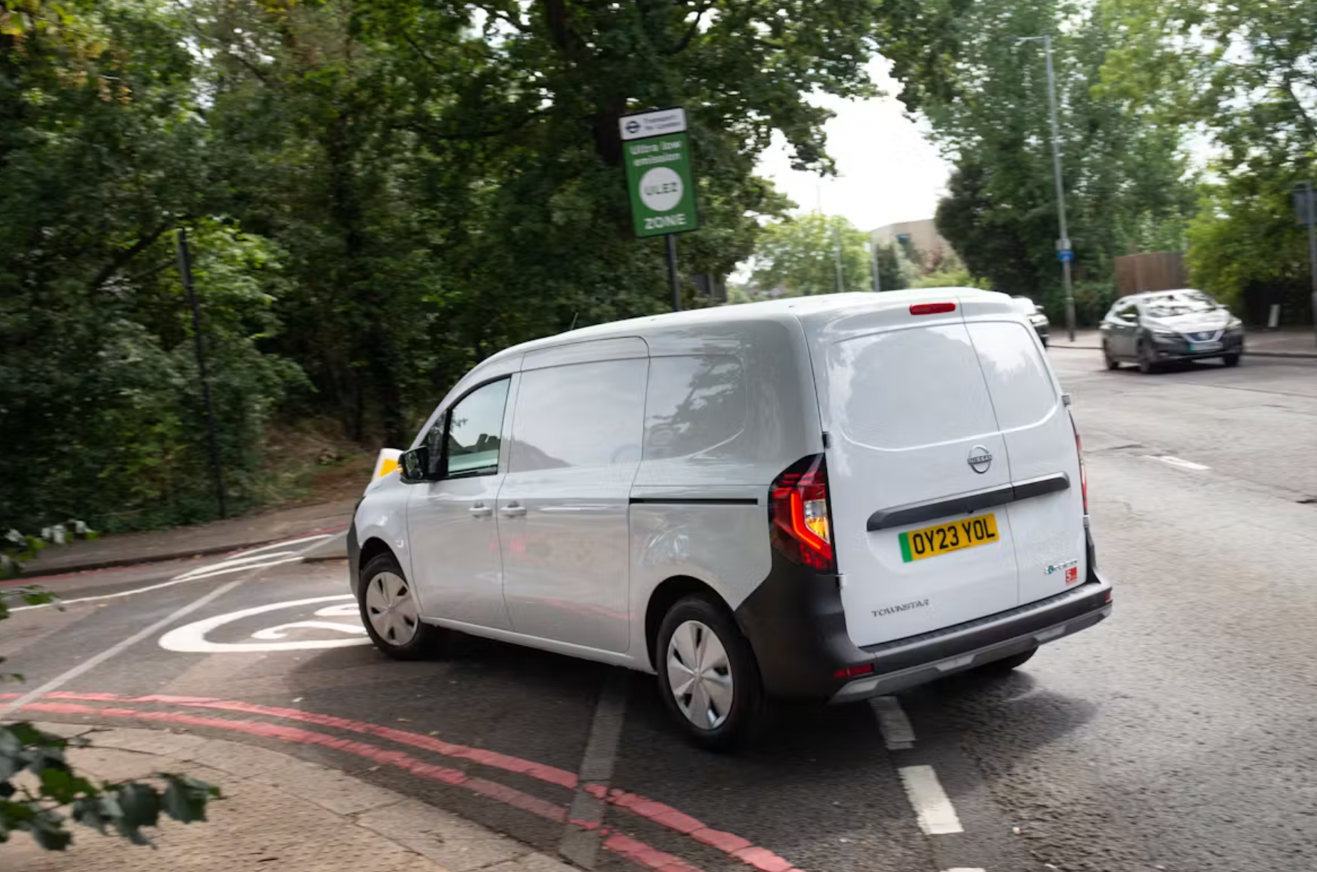 Electric van on london road near ULEZ sign