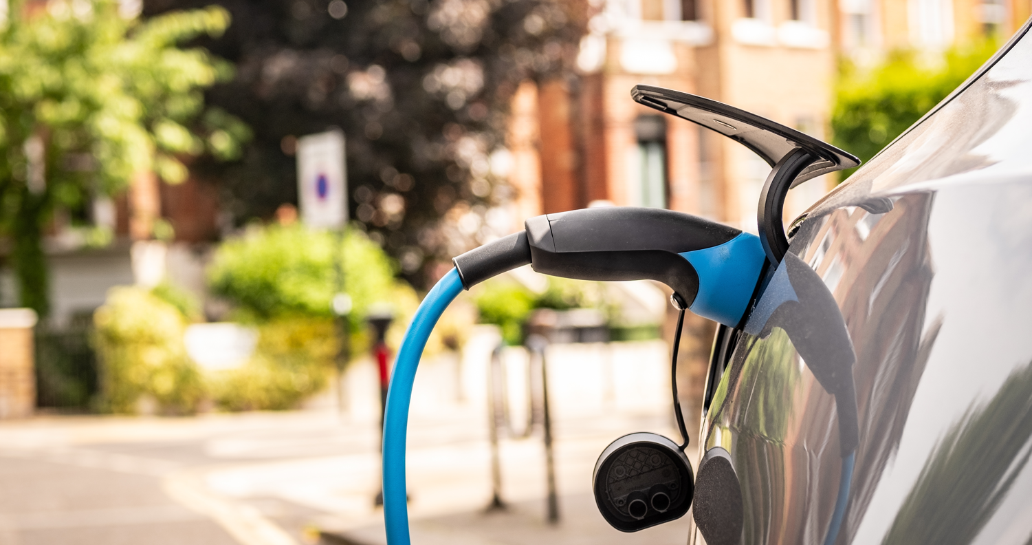 Car plugged in on residential street