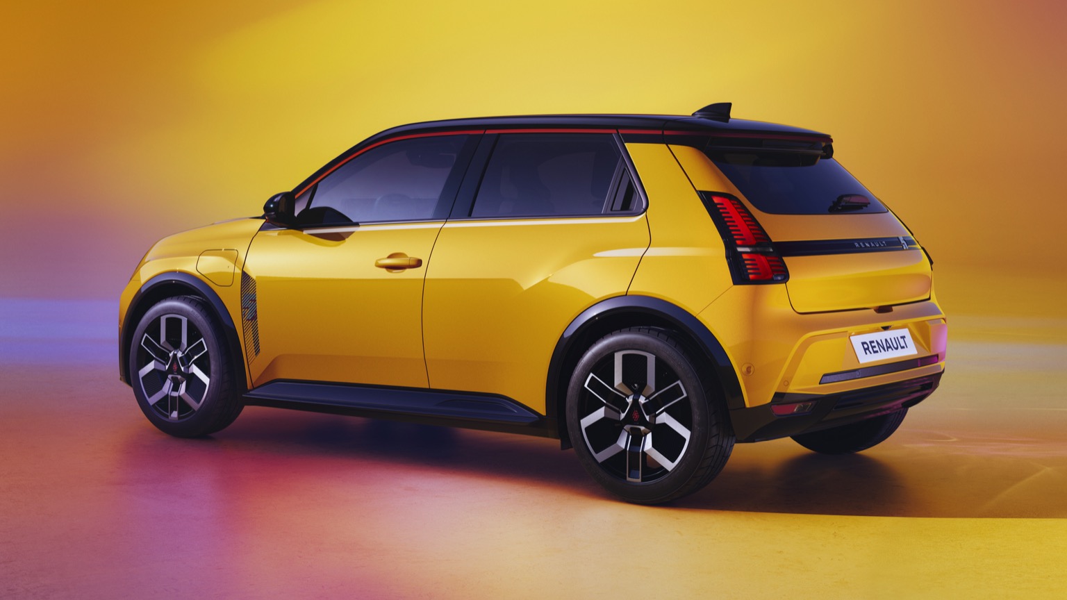 Renault 5 etech yellow EV side view