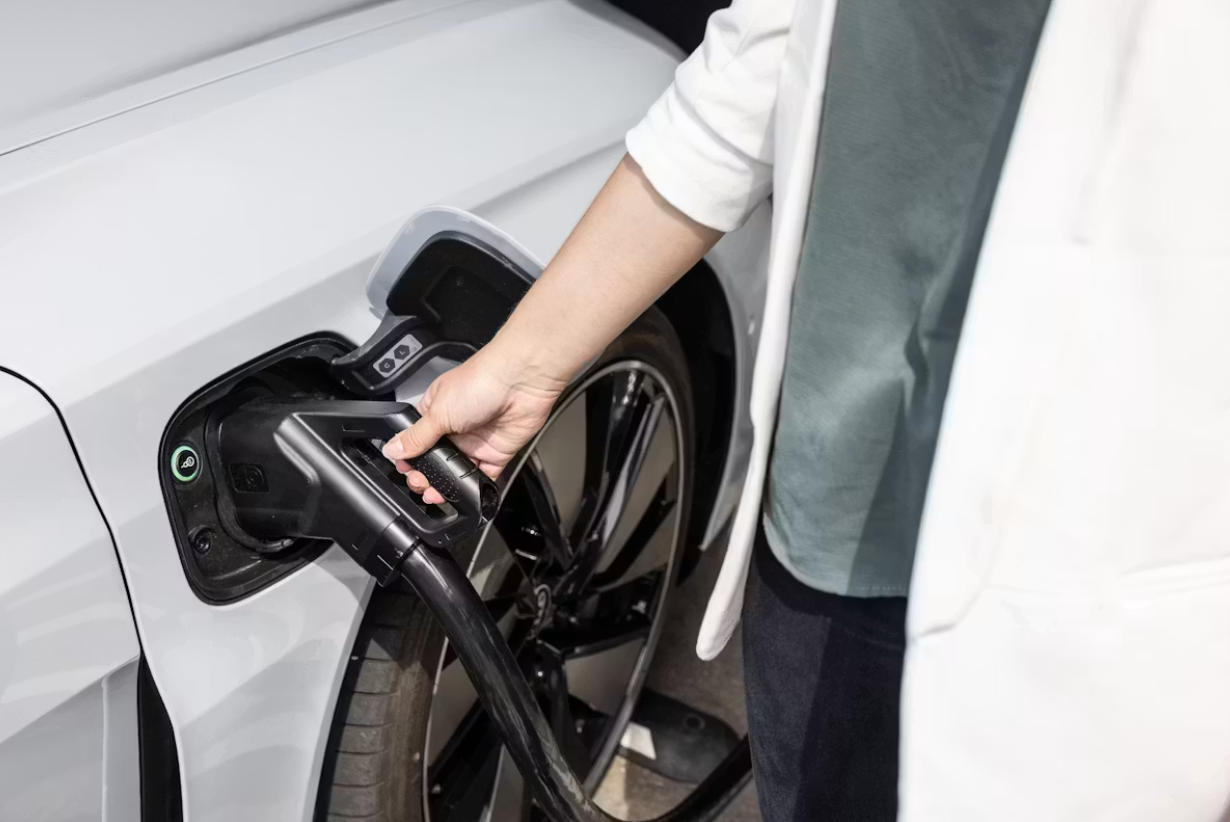 Plugging in electric car to charge